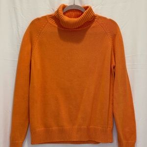 orange turtleneck sweater